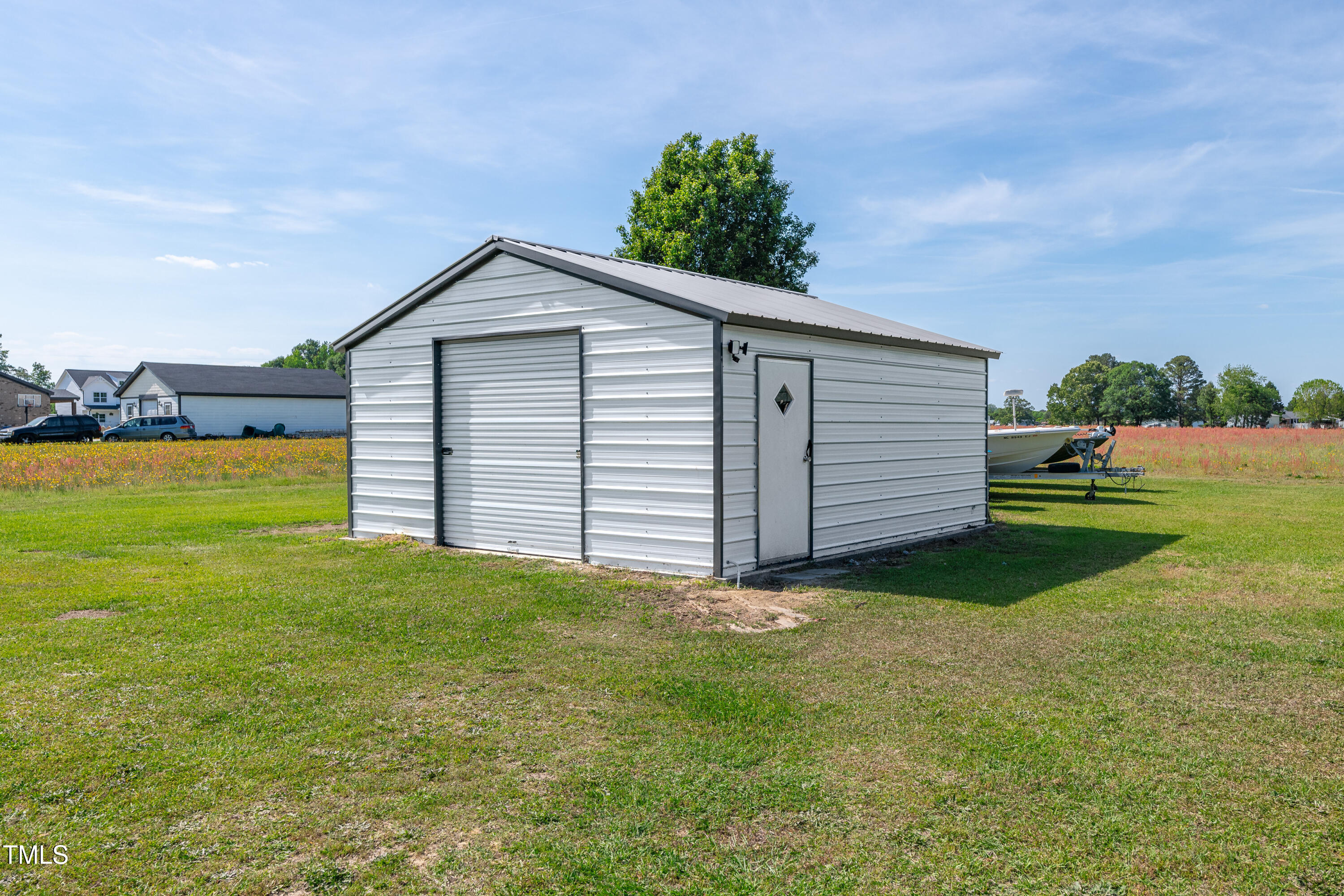 640 Short Journey Road Smithfield, NC 27577 - Photo 4 of 27 a view of a backyard with a garden