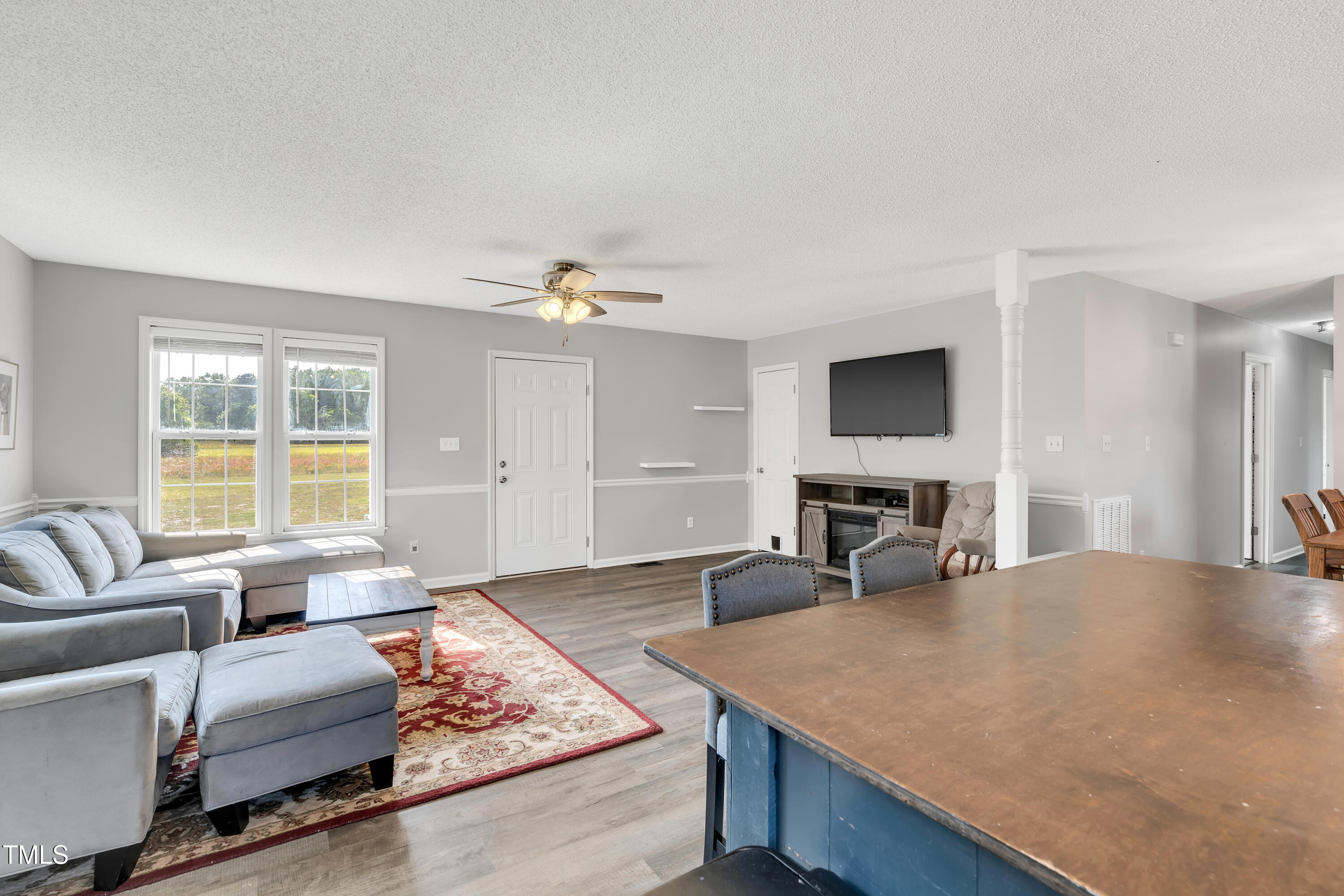 640 Short Journey Road Smithfield, NC 27577 - Photo 8 of 27 a living room with furniture and a flat screen tv
