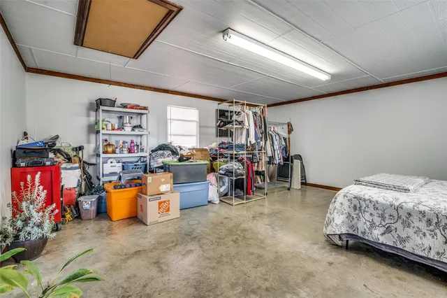 a bed room with furniture and a gym