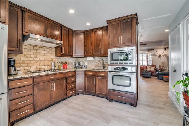 a kitchen with sink cabinets and window