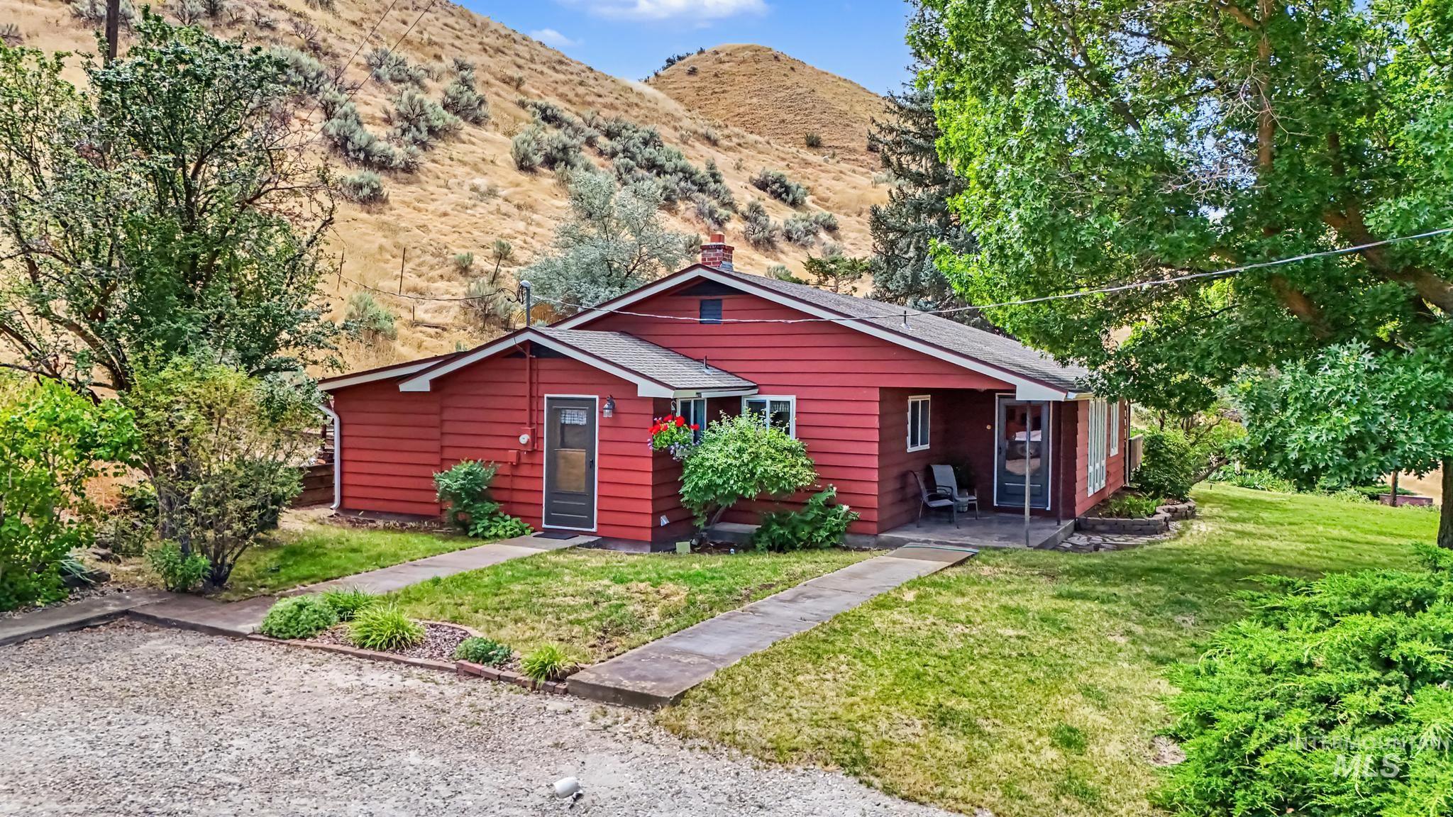 4311 Frozen Dog Road Emmett, ID 83617 - Photo 1 of 31 Red-sided residence featuring a front entry porch and a smaller side porch