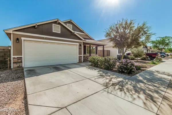 a front view of a house with a garage