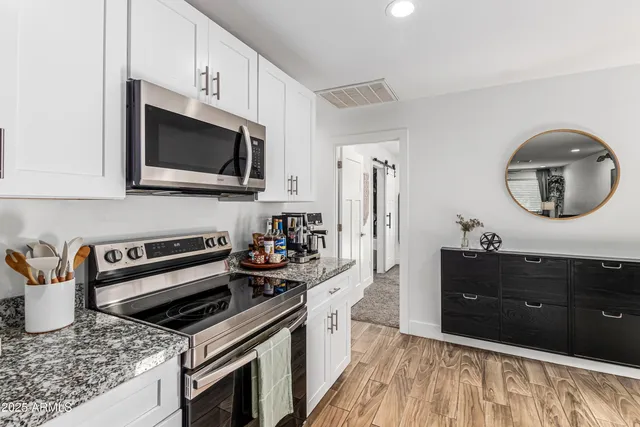 a kitchen with a stove and a microwave