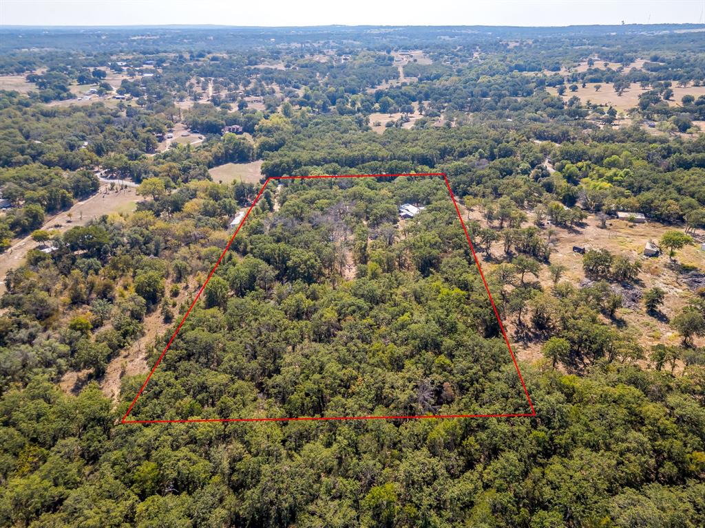 436 Luke Road Springtown, TX 76082 - Photo 37 of 39 Aerial overview of property's location featuring property boundaries highlighted and a heavily wooded area from rear of property North looking toward front of property South