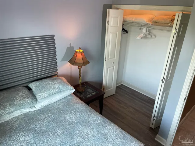 a view of a hardwood floor and wardrobe