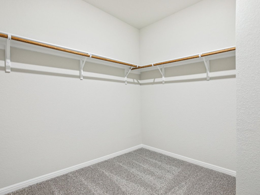 104 Honey Bee Road Jarrell, TX 76537 - Photo 13 of 17 a view of a room with racks on the wall