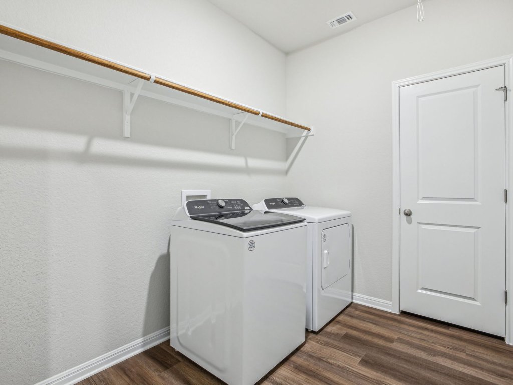 104 Honey Bee Road Jarrell, TX 76537 - Photo 14 of 17 a utility room with wooden floor washer and dryer