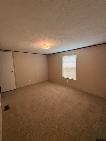 a view of a hallway to a chair