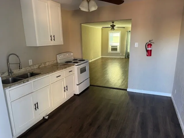 a kitchen with a sink and cabinets