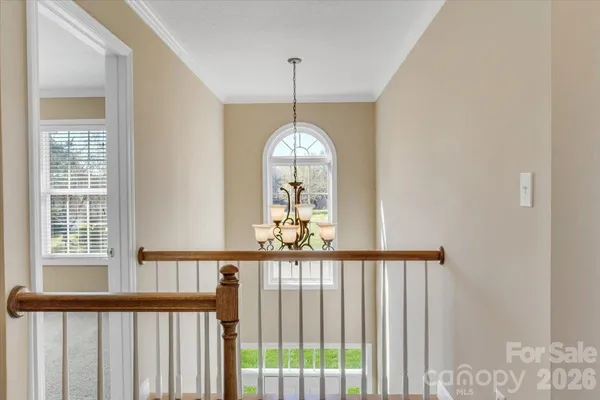 a view of a hallway with windows
