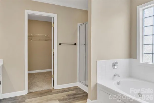 a bathroom with a bathtub and a shower