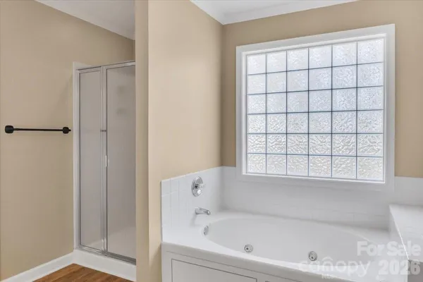a white bath tub sitting next to a window