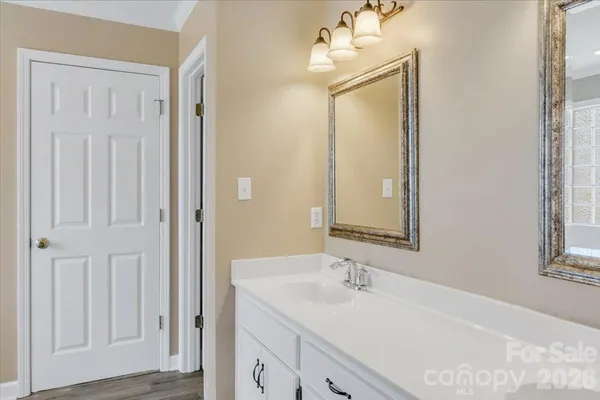 a bathroom with 2 sink and a mirror