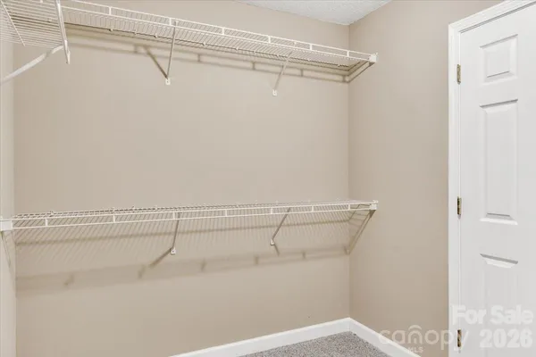 a view of a room with racks on the wall