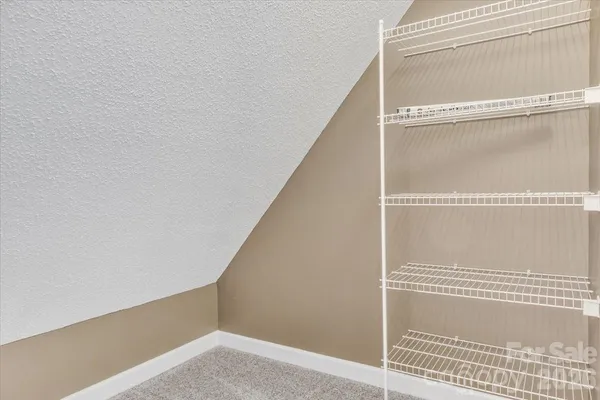 a view of a hallway with closet