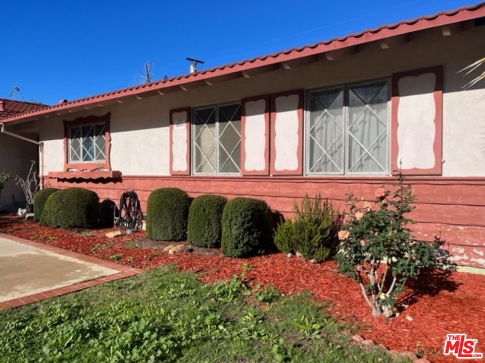 18665 Horace Street Porter Ranch, CA 91326 - Photo 2 of 13 a front view of a house with a yard