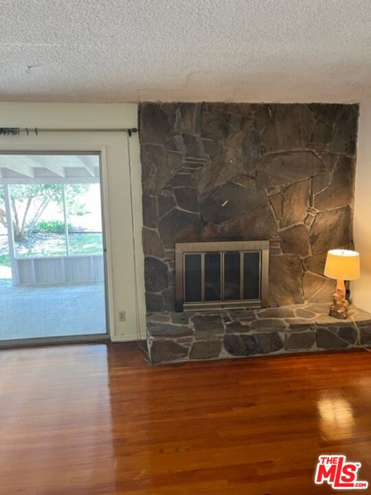 18665 Horace Street Porter Ranch, CA 91326 - Photo 3 of 13 a view of living room with furniture and a fireplace