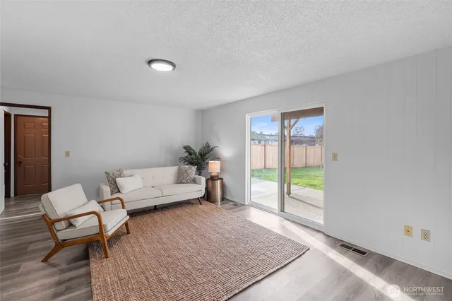 a living room with furniture and a gate