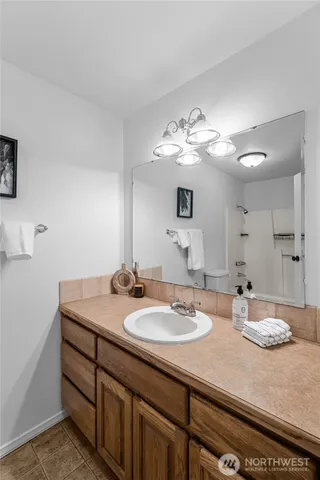 a bathroom with a sink double vanity and a mirror
