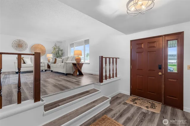 a view of a livingroom with furniture and windows