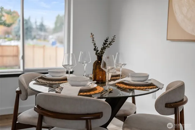a view of a dining room with furniture window and outside view