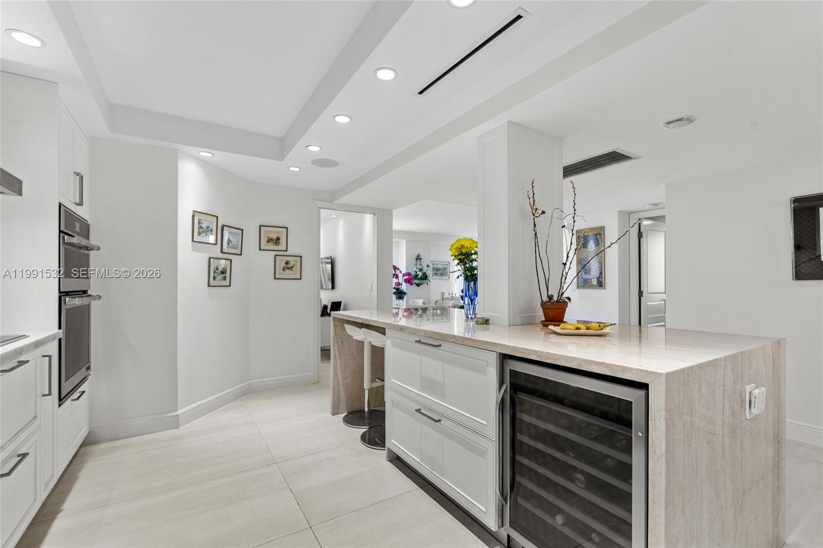9801 Collins Avenue, Unit 5R Bal Harbour, FL 33154 - Photo 12 of 47 a kitchen with stainless steel appliances a sink stove and refrigerator