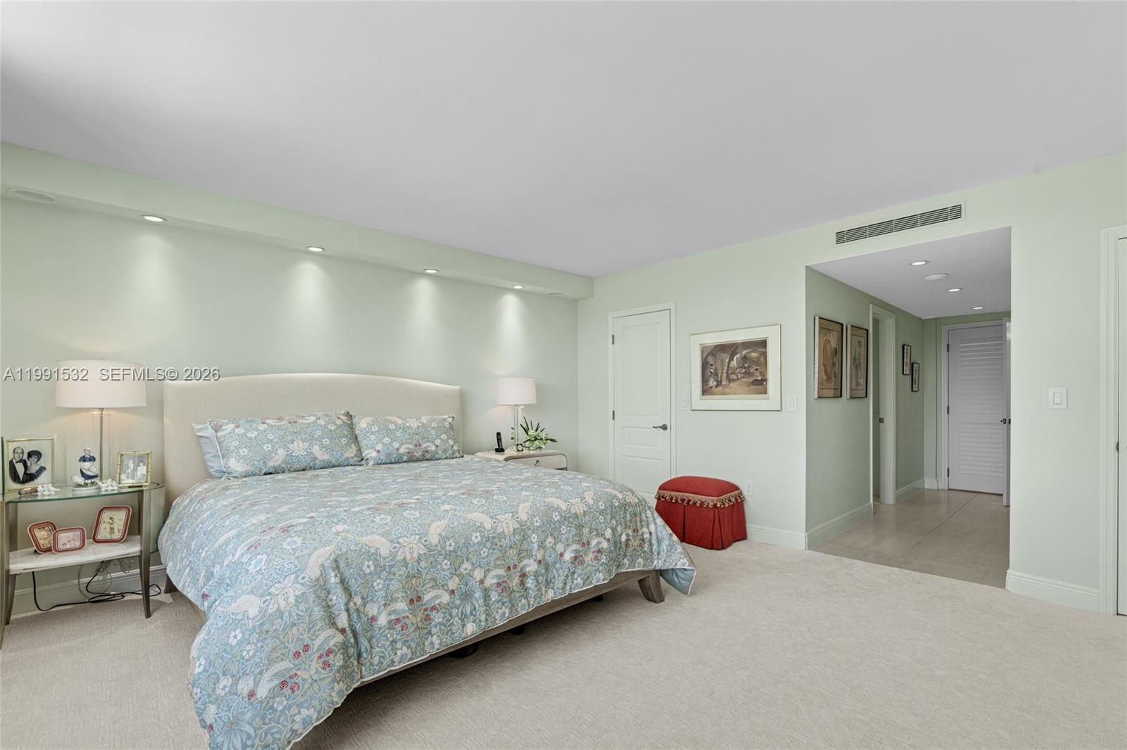 9801 Collins Avenue, Unit 5R Bal Harbour, FL 33154 - Photo 26 of 47 a bedroom with a bed and lamp