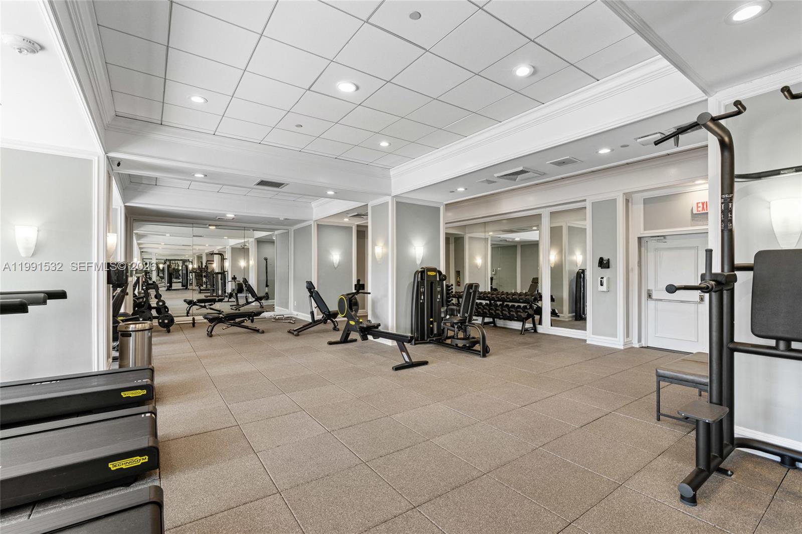 9801 Collins Avenue, Unit 5R Bal Harbour, FL 33154 - Photo 35 of 47 a view of a room with gym equipment