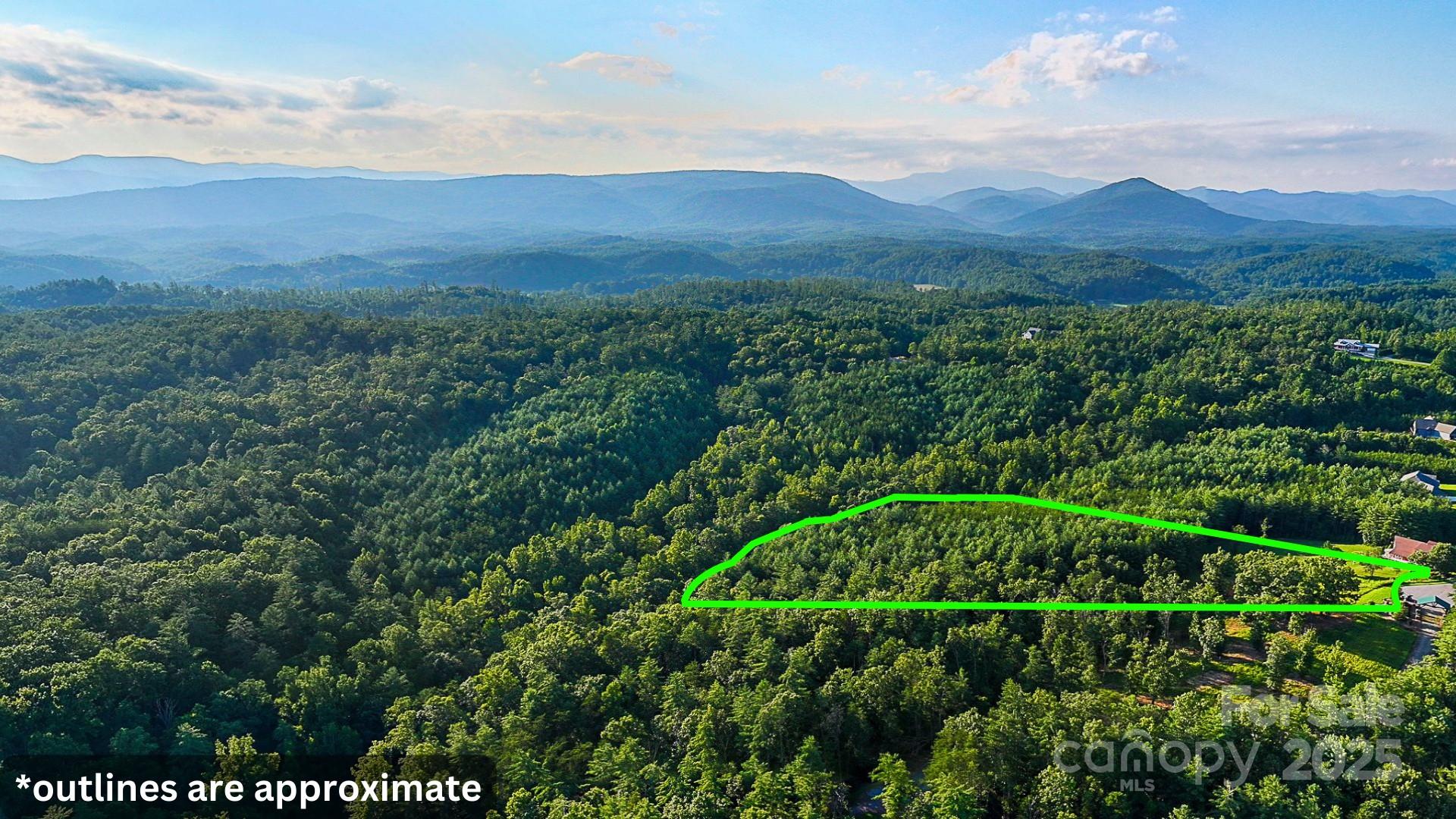 1106 Table View Drive Morganton, NC 28655 - Photo 2 of 12 a view of a lush green hillside and a houses