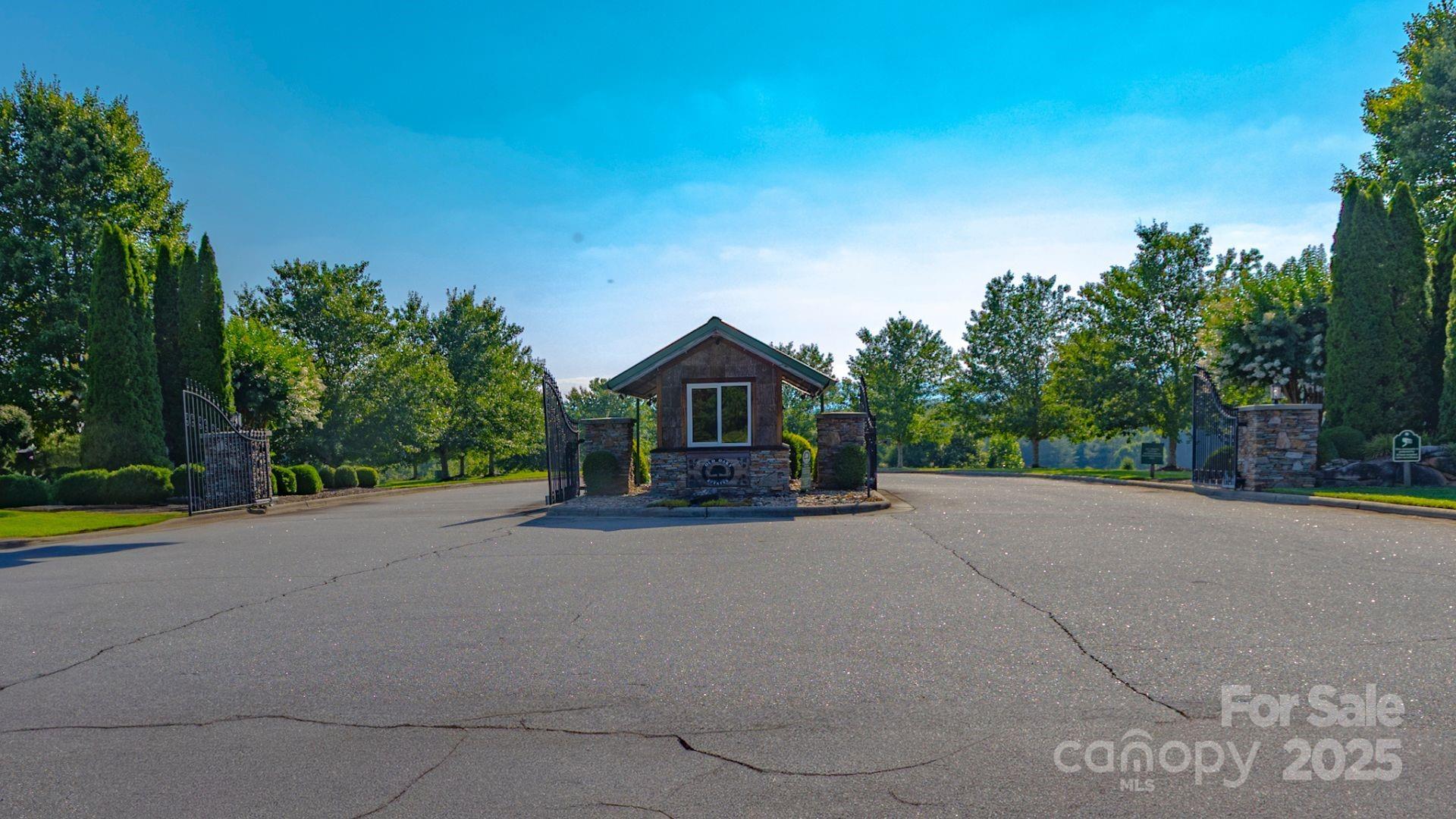 1106 Table View Drive Morganton, NC 28655 - Photo 10 of 12 a view of a house with a yard and large trees