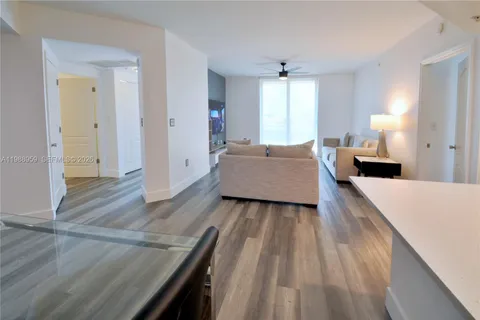 a spacious bedroom with a bed and a dresser