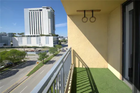 a view of balcony with furniture