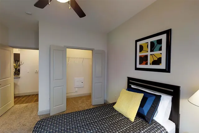 a bedroom with bed and window