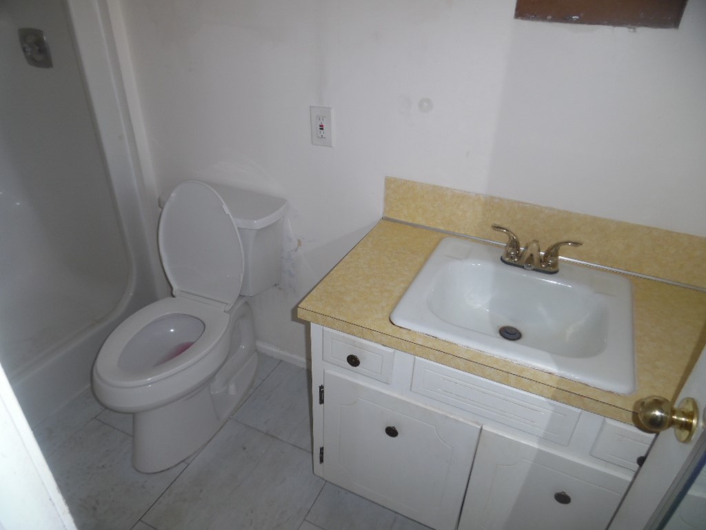 1207 Williamsburg Drive Anderson, SC 29621 - Photo 11 of 13 This bathroom features a functional vanity and a clean toilet, ready for personal touches.