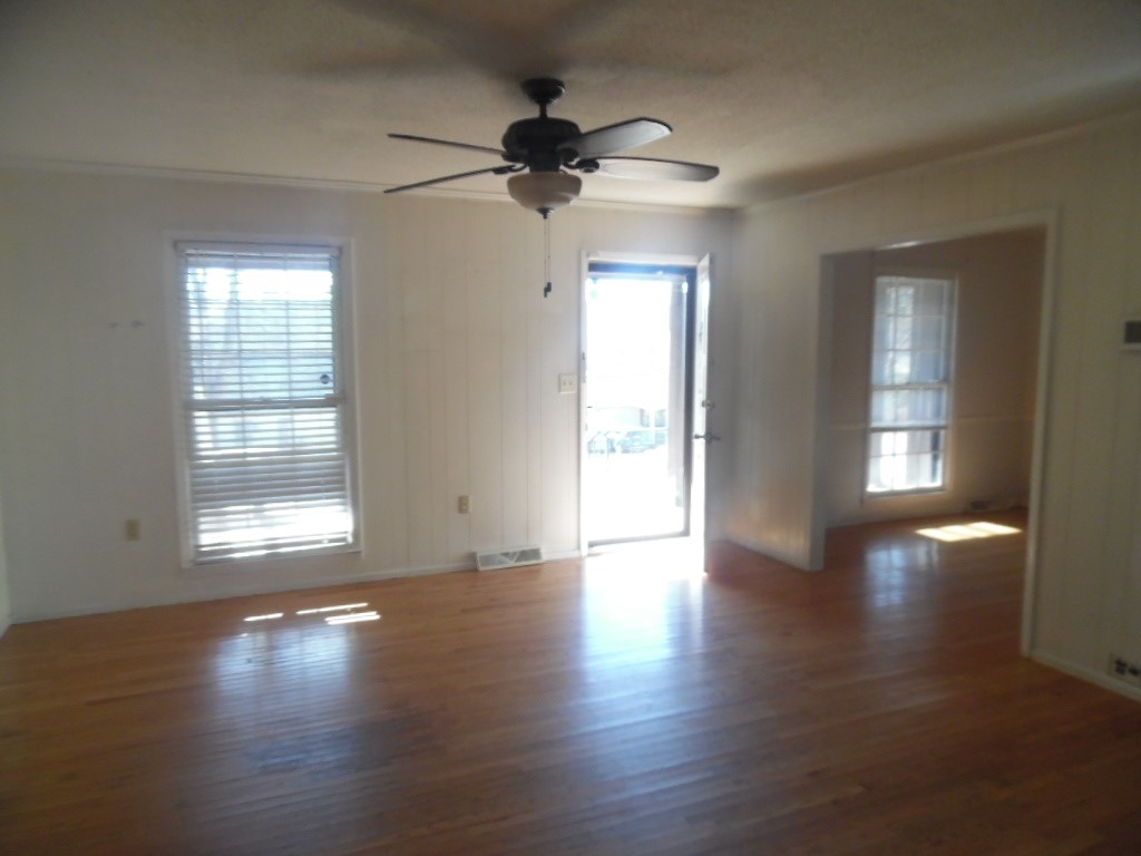 1207 Williamsburg Drive Anderson, SC 29621 - Photo 6 of 13 Bright, inviting room with polished wood floors and abundant natural light.