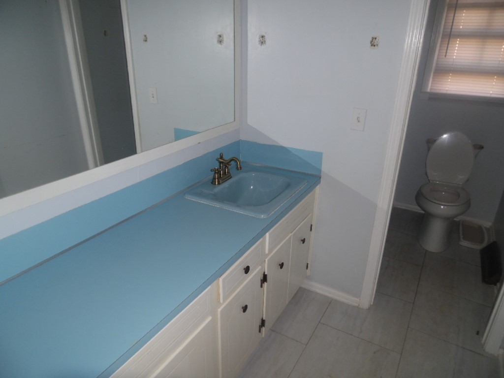 1207 Williamsburg Drive Anderson, SC 29621 - Photo 8 of 13 This bathroom features a sleek vanity and convenient toilet area.