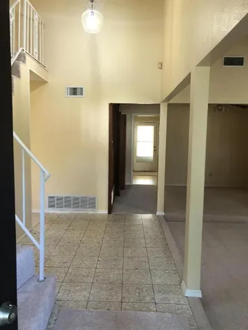 a view of a hallway with a bathroom