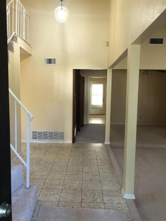 222 Syracuse Place Richardson, TX 75081 - Photo 3 of 13 a view of a hallway with a bathroom