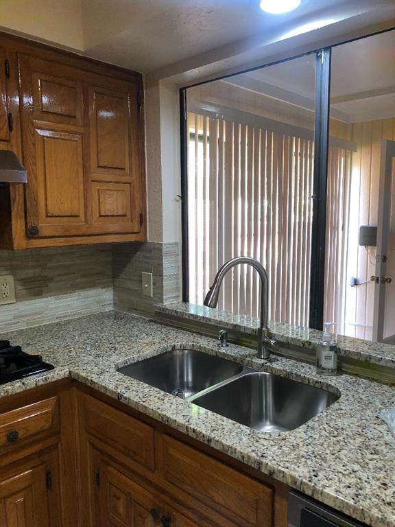 222 Syracuse Place Richardson, TX 75081 - Photo 6 of 13 a kitchen with a sink cabinets and window