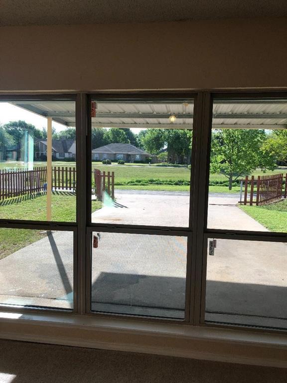 222 Syracuse Place Richardson, TX 75081 - Photo 8 of 13 a view of a glass door with a yard