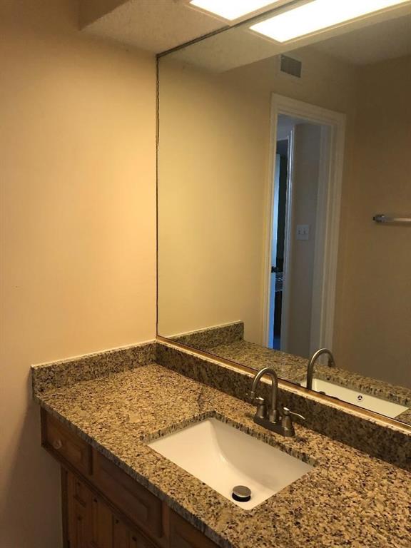 222 Syracuse Place Richardson, TX 75081 - Photo 9 of 13 a bathroom with a granite countertop sink and a mirror