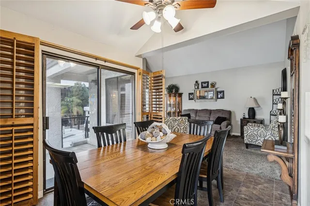 a dining room with furniture window and wooden floor