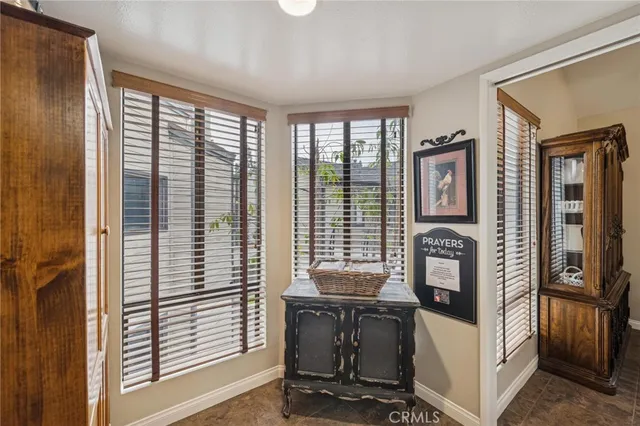 a view of a livingroom with furniture and windows
