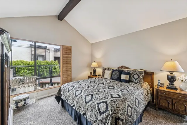 a bedroom with a large bed and a large window