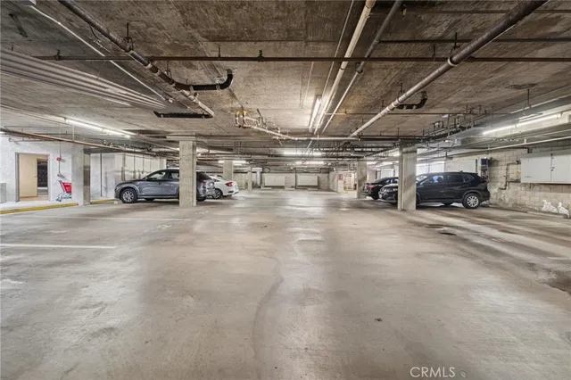 a view of parking garage with cars