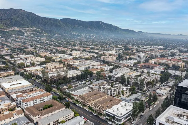 an aerial view of residential house and sandy dunes
