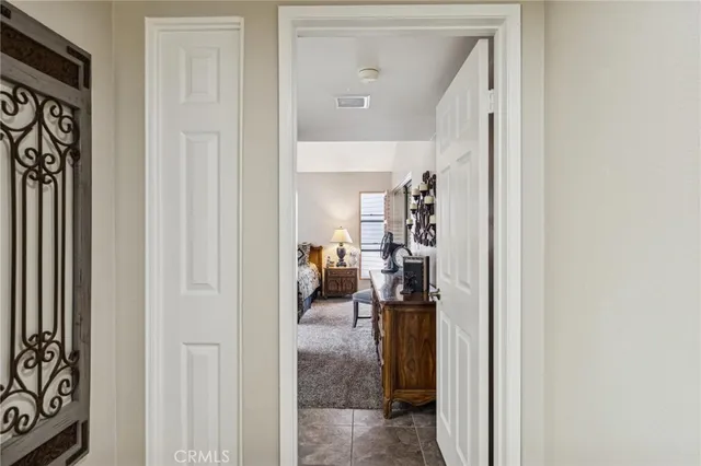 a view of a hallway view with living room and with furniture