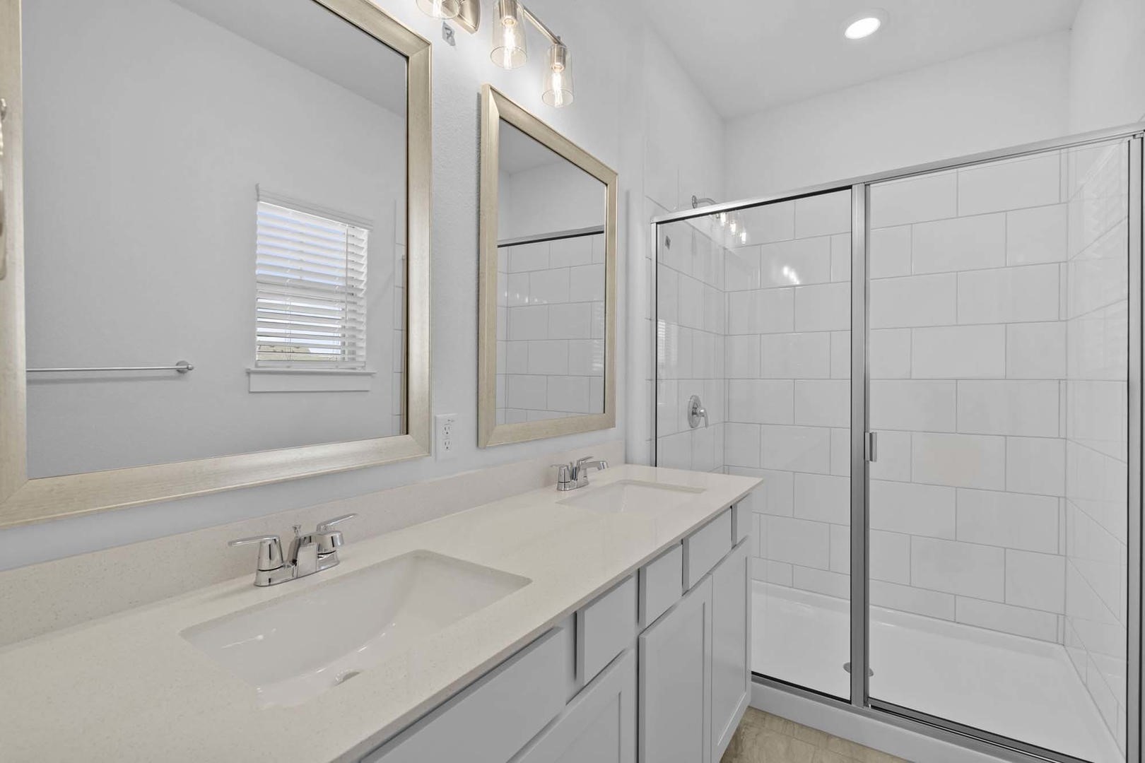 6400 Stockman Drive, Unit 6 Austin, TX 78747 - Photo 14 of 36 a bathroom with a shower sink vanity and mirror