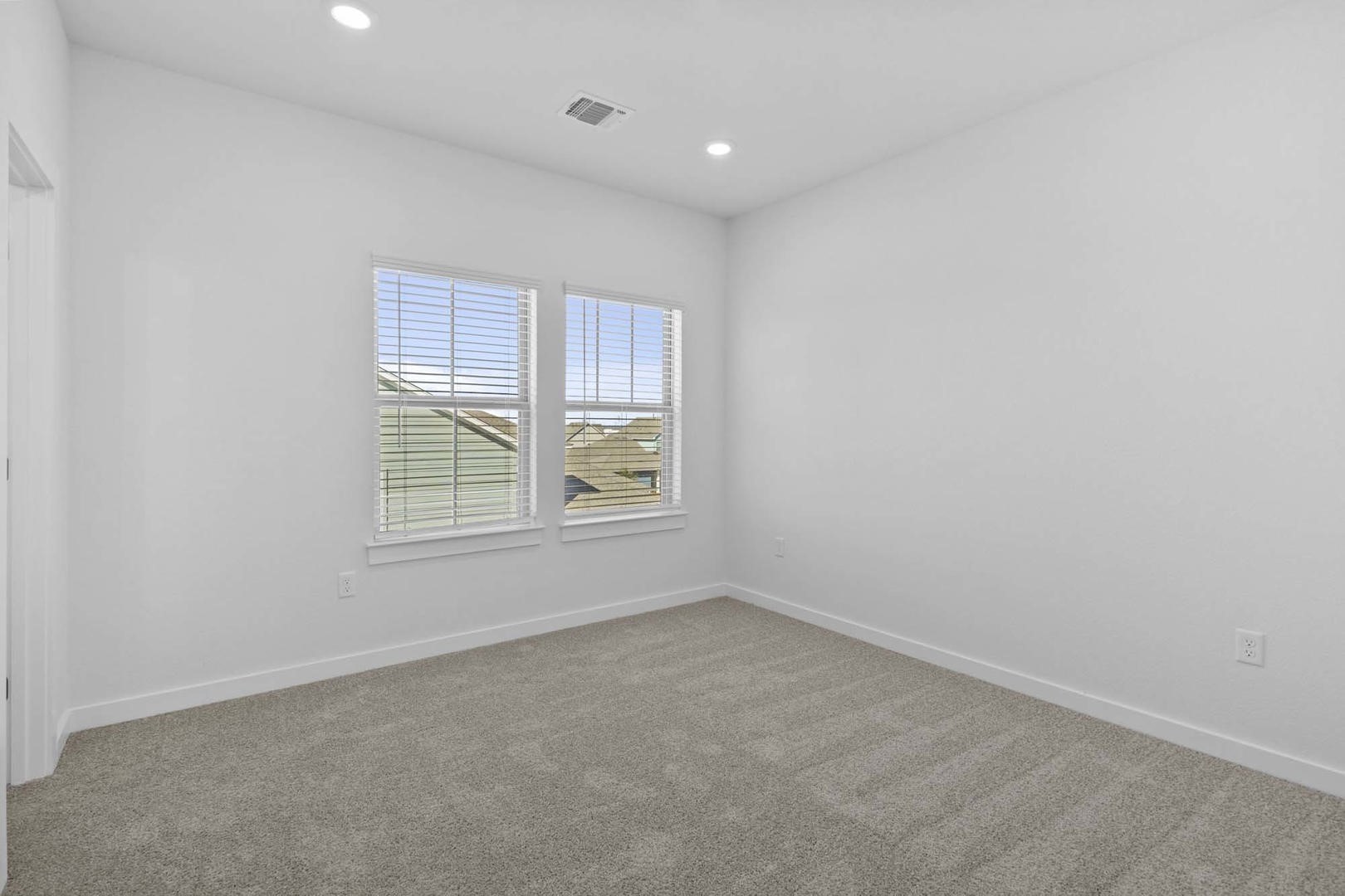6400 Stockman Drive, Unit 6 Austin, TX 78747 - Photo 25 of 36 an empty room with windows
