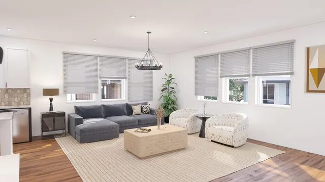 a living room with furniture and a chandelier